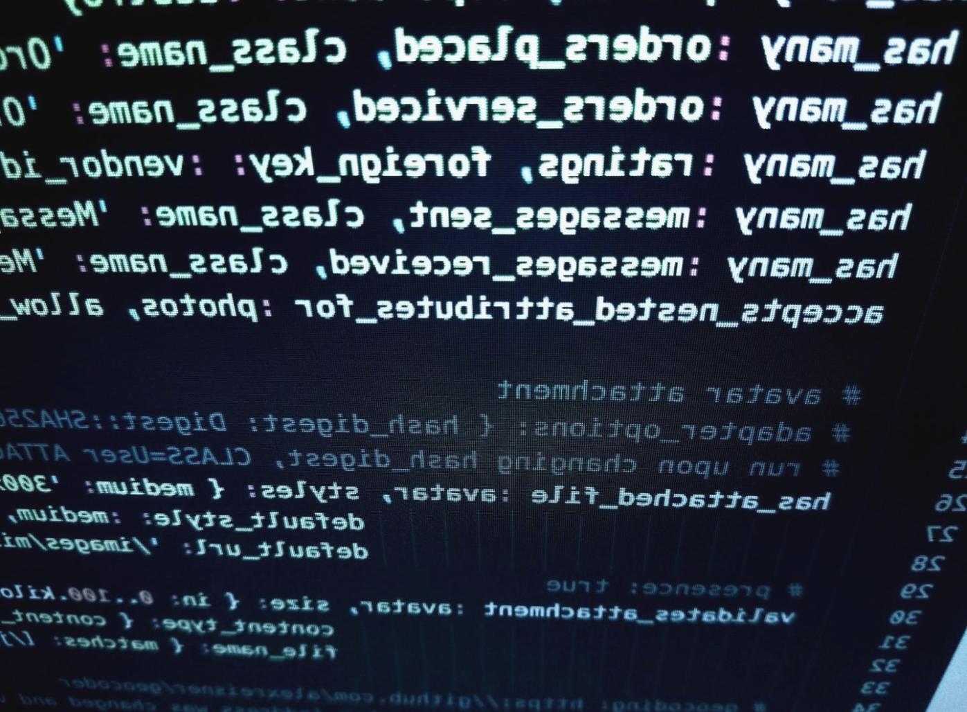 Students working on debugging real applications during hands-on learning session